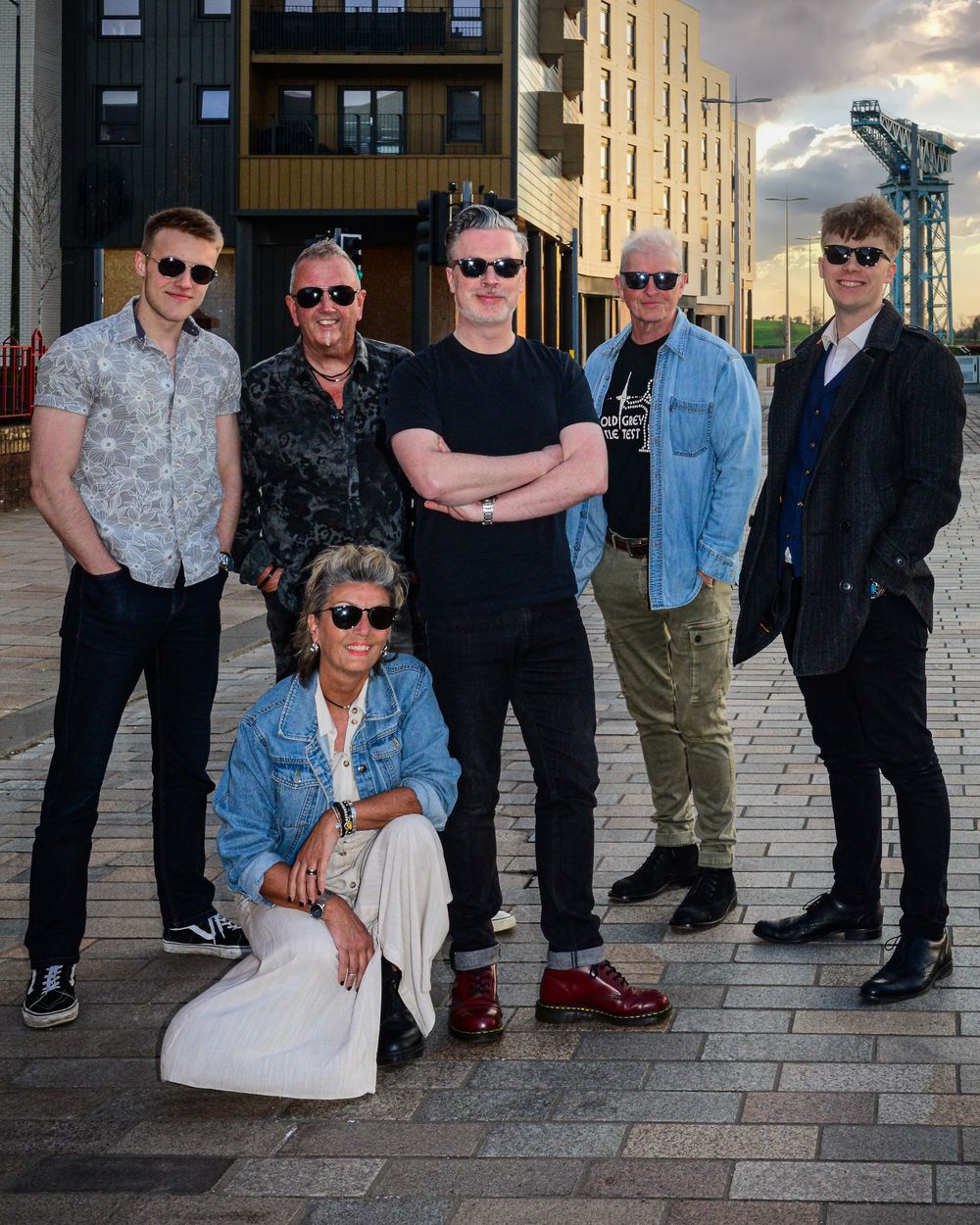 The six members of Dignity photographed together on a Glasgow street